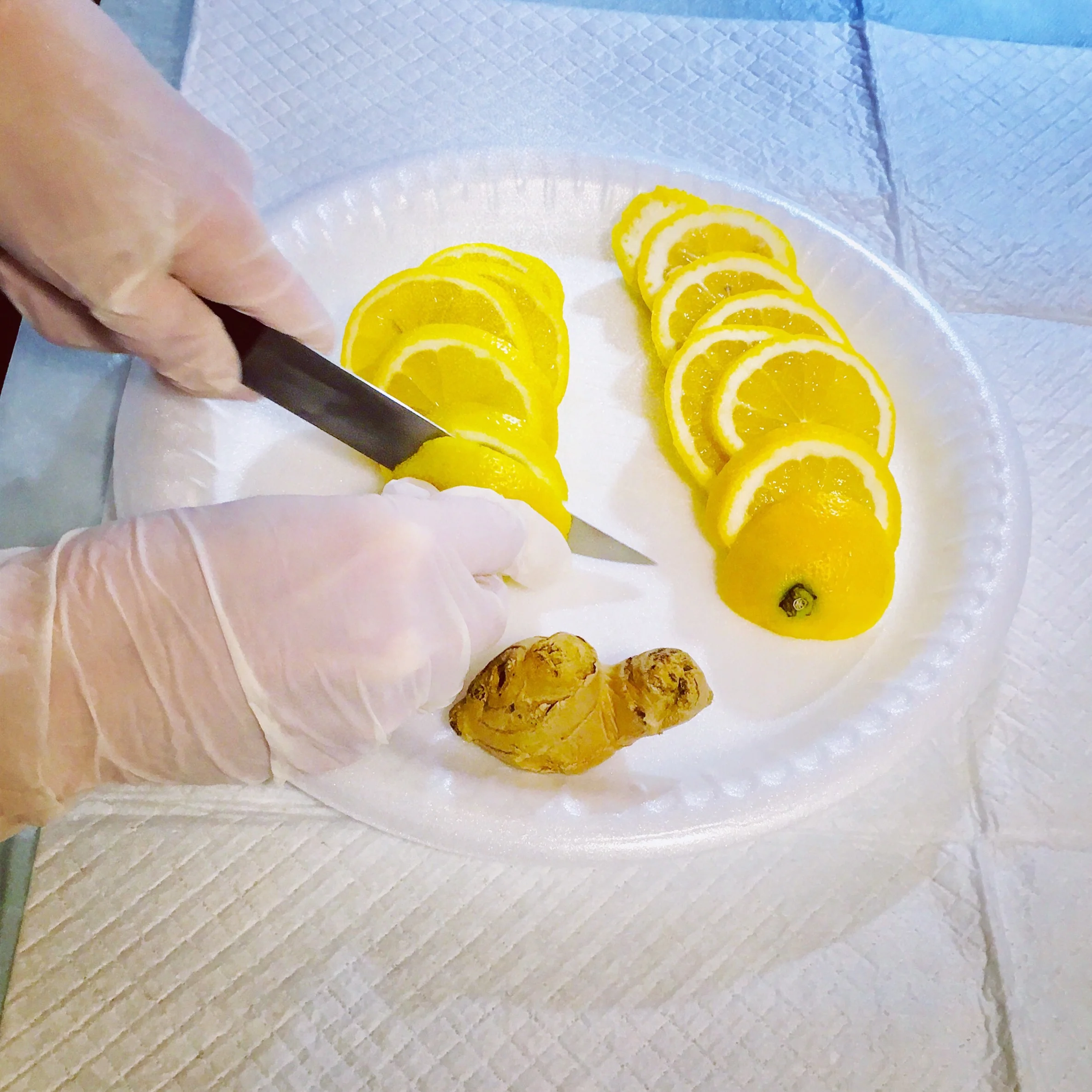 Preparing lemon and ginger for traditional Chinese method of steaming placenta.