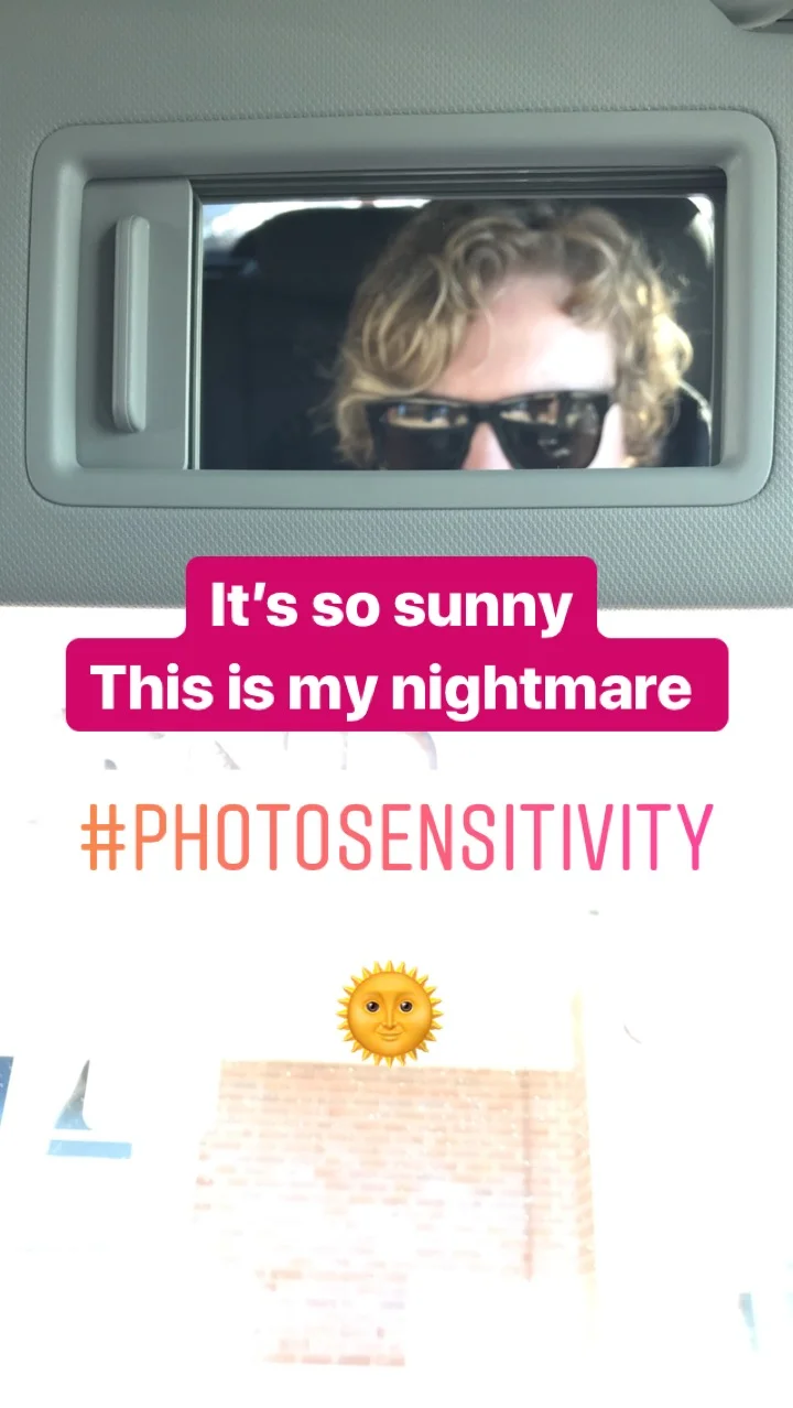 Selfie of me wearing sunglasses with the text: this is my nightmare #photosensitivity
