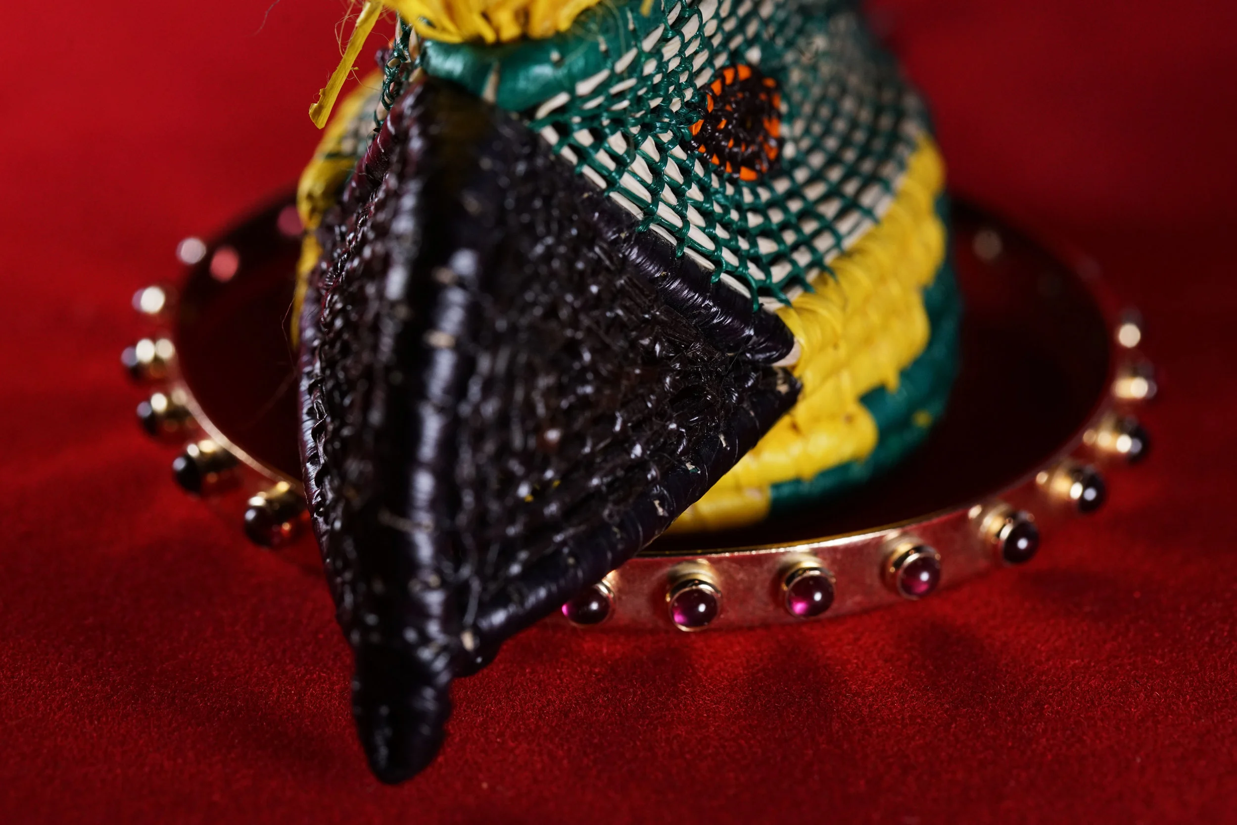  A 14k gold bangle bracelet featuring cabochon garnets. 