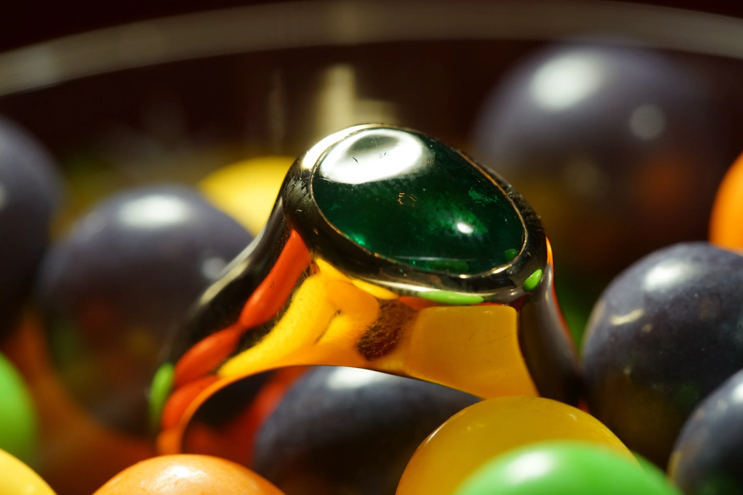  Almost 5 carats of tumbled emerald set in hand-carved 18k gold. 