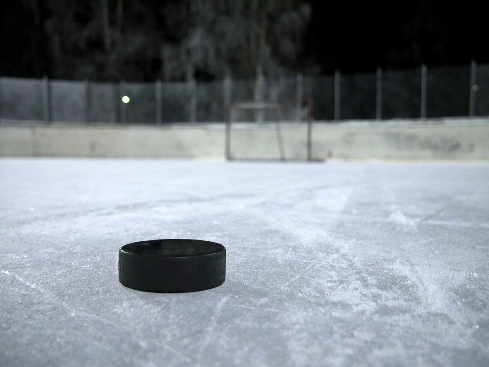 Ice_hockey_puck_on_ice_20180112.jpg
