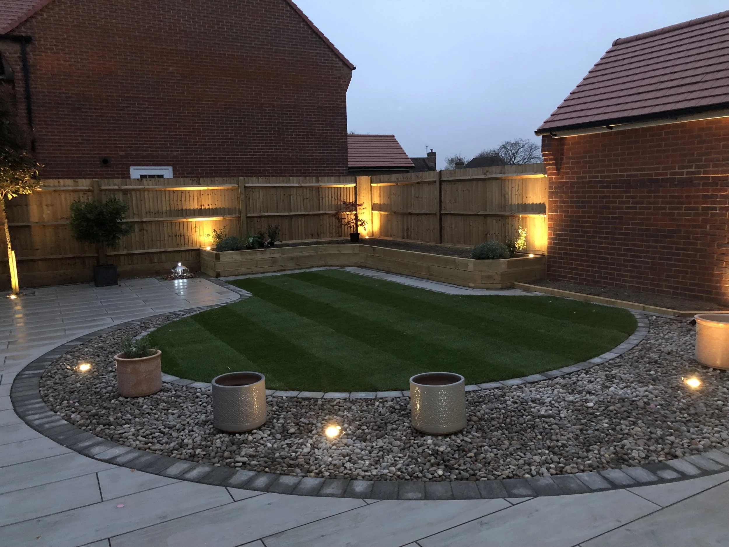 Om this garden makeover we used lights all around the garden, within the paving as well as in the planters we created, this garden is stunning at night.