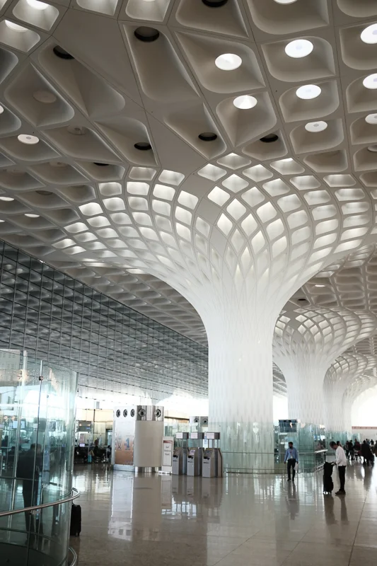 The beautiful departure hall of Mumbai International, designed by SOM (Skidmore Owings and Merrill), was completed in 2014; the other parts of the terminal, arrival and gates, are less remarkable. One annoying aspect of all airports in India: Once y…