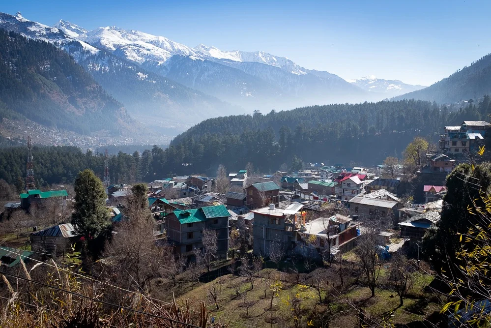 Old Manali, up the hill from the river and surrounded by apple orchards. The smog, caused by traffic and heating, is clearly visible.