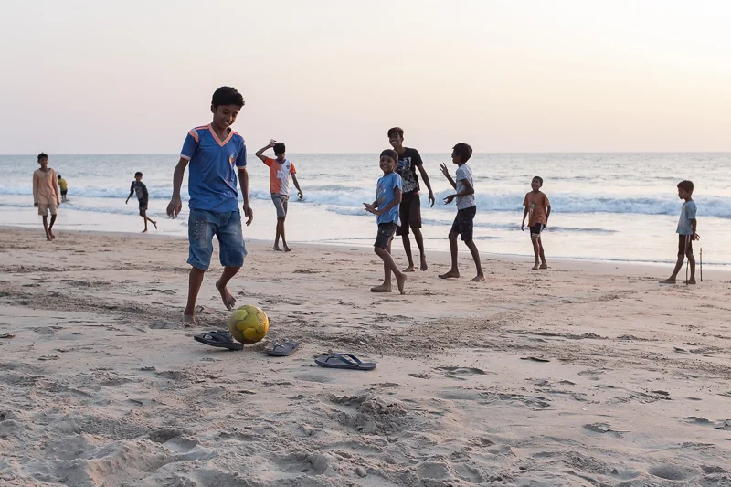 Around sunset local boys came to the beach for football.