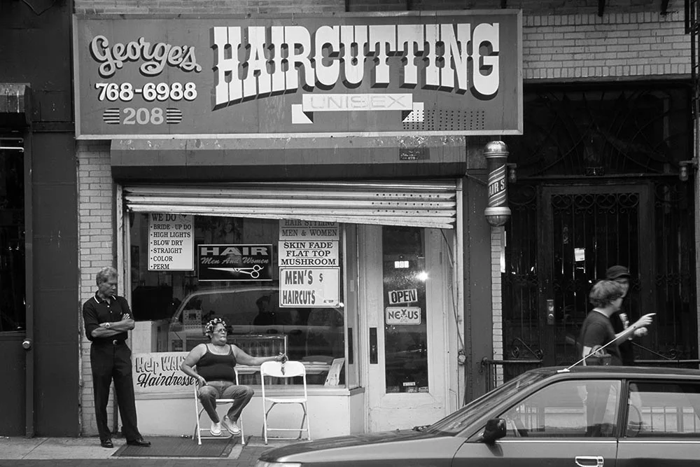 Black and white photo of a barber shop in Park Slope, Brooklyn.