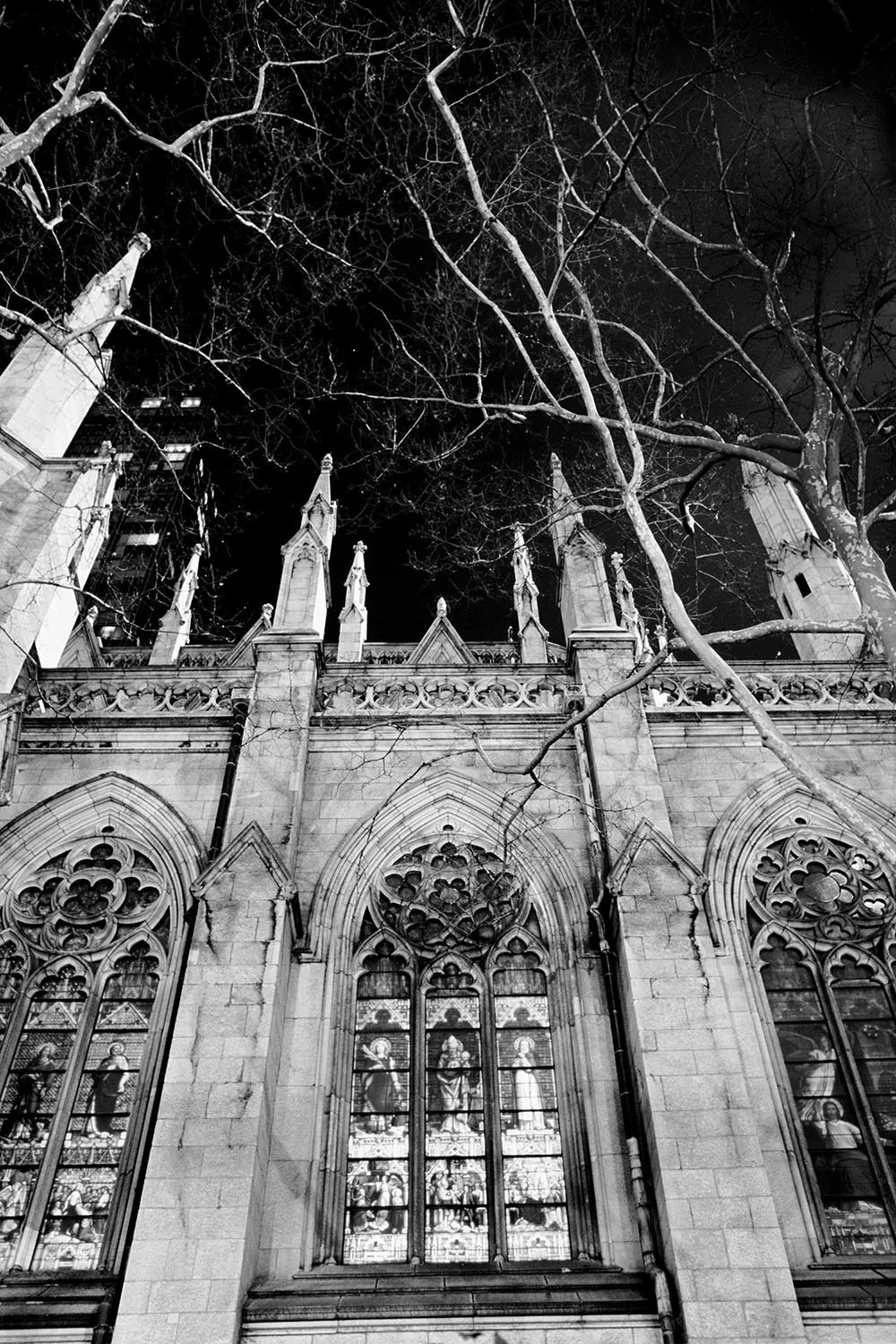 Black and white photograph of the stained glass windows at St. Patrick's Cathedral.