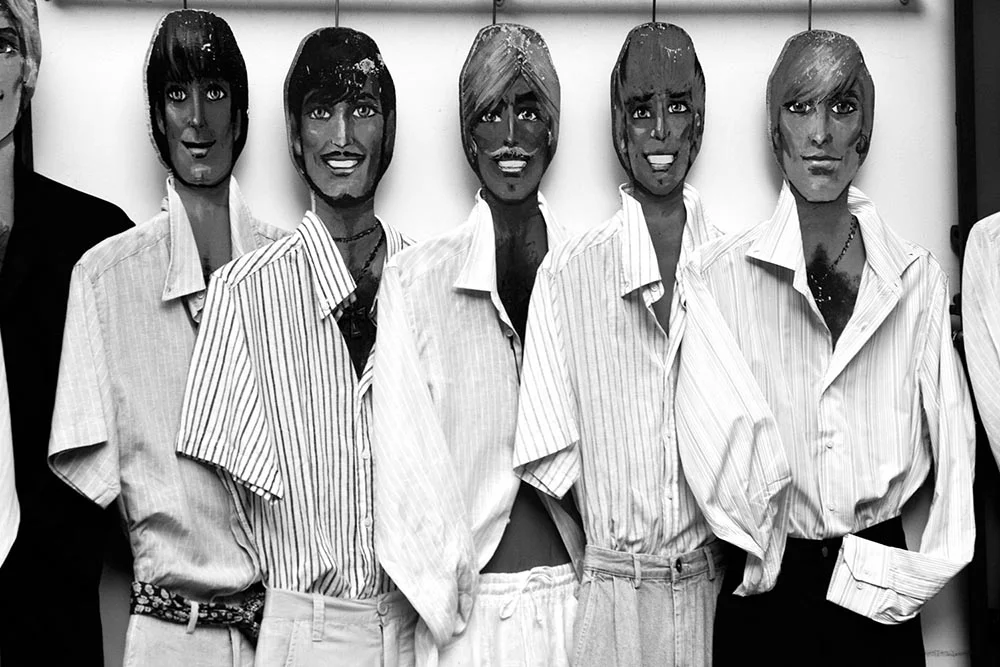 Black and white photograph of wooden mannequins in Positano, Italy.
