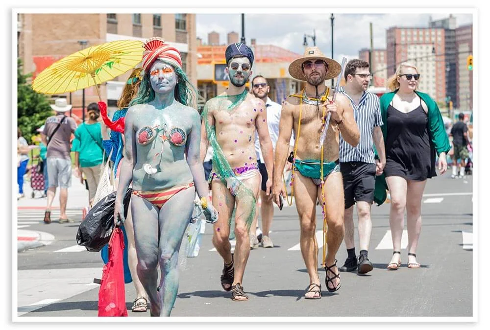 A couple of mermen join the festivities.