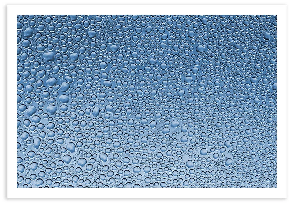 1:1 macro photo of water droplets collected on a piece of cellophane. Exif Data: 1/5 sec ; f/7.1 ; ISO 100