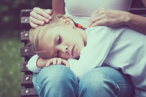 stock-photo-sad-mother-and-daughter-sitting-on-bench-in-the-park-at-the-day-time-309868472.jpg