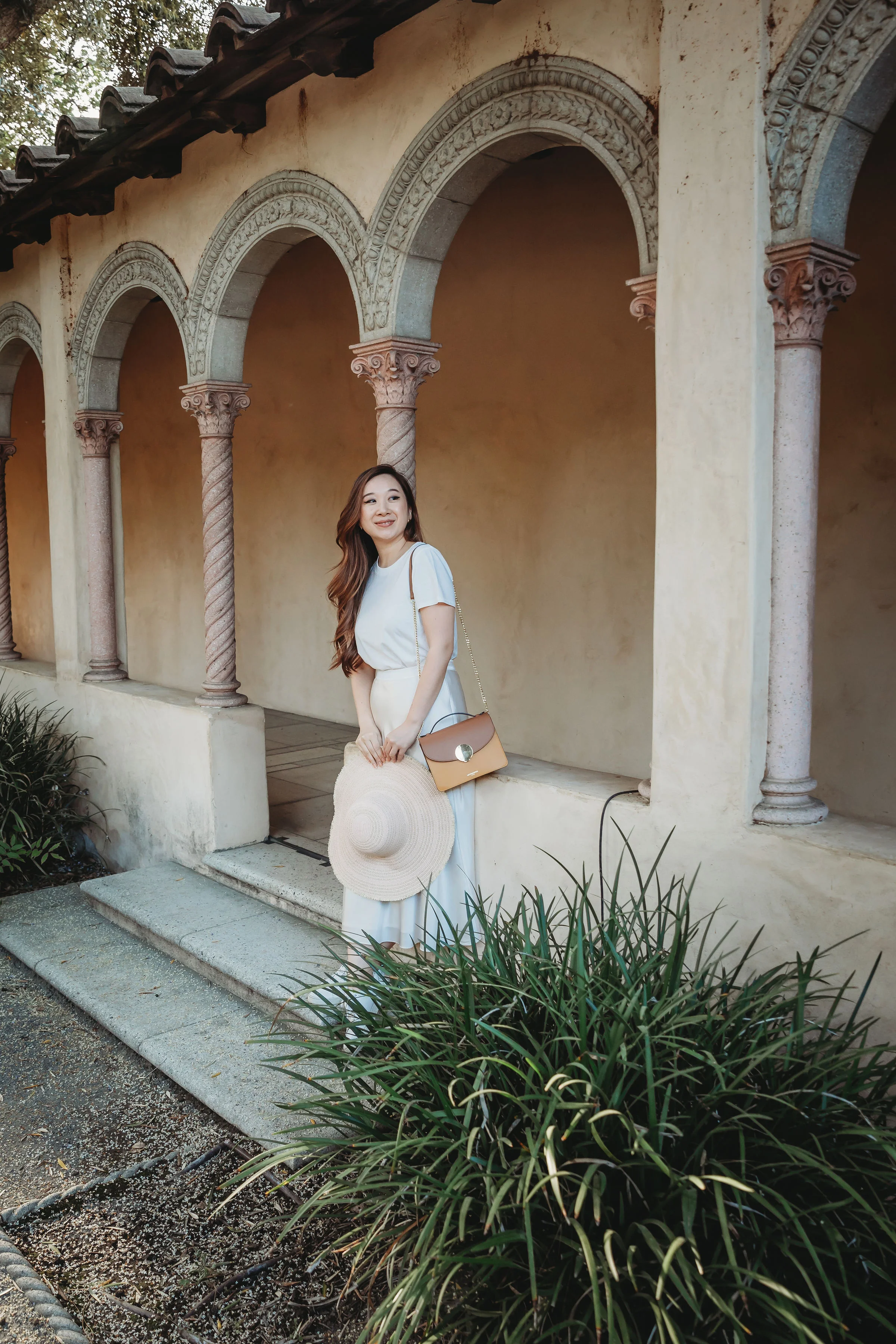 I wore the white t-shirt over Maggie Wu Studio’s ivory silk skirt and paired the outfit with white sneakers. Photos by Rebecca Zeller .