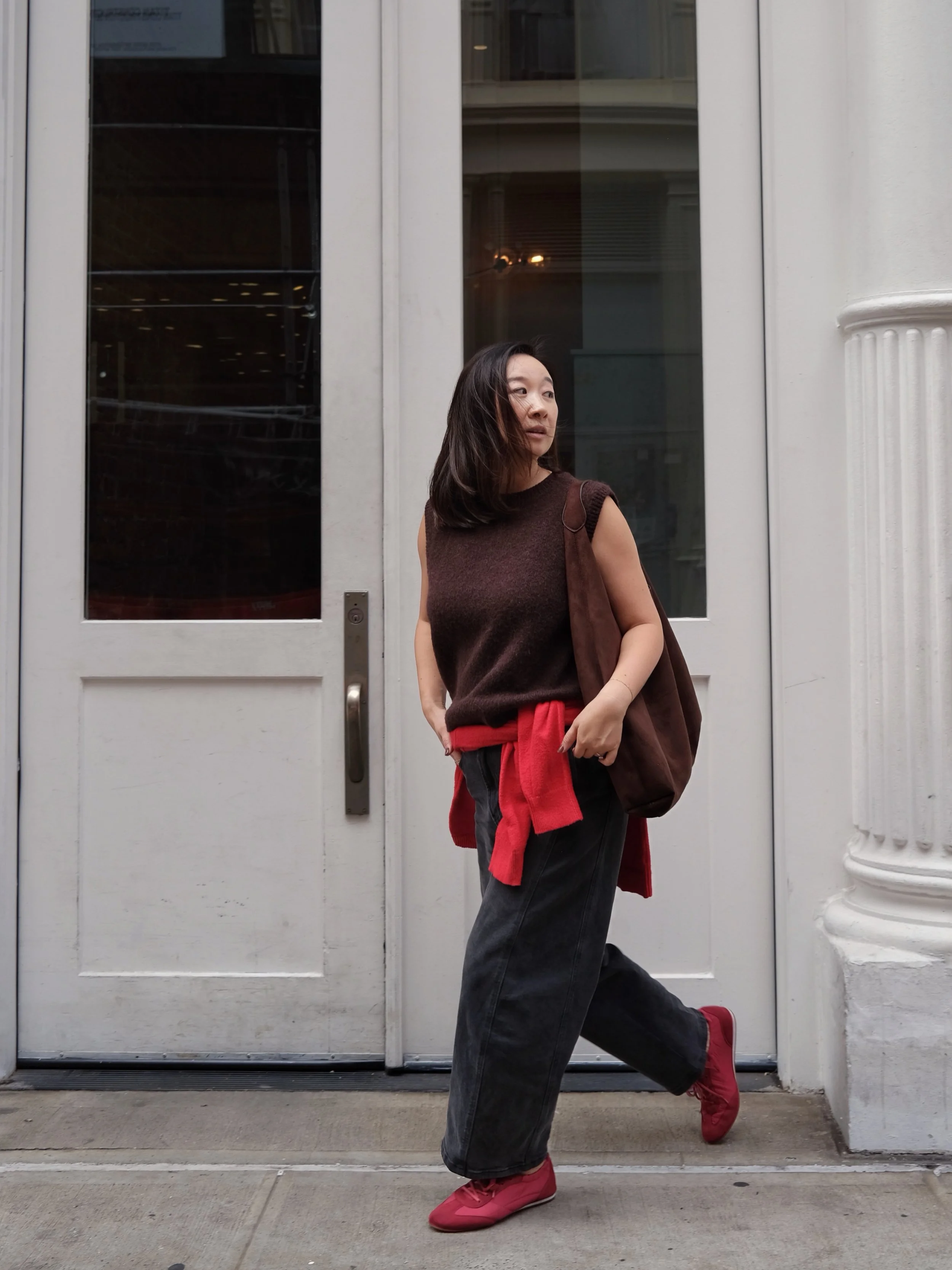 Outfits worth repeating, part one: A brown knit vest, black barrel jeans, and a little red in two places. The sweater is partly for the outfit, mostly because I may be cold later on a hot, sort of rainy fall day in NYC.