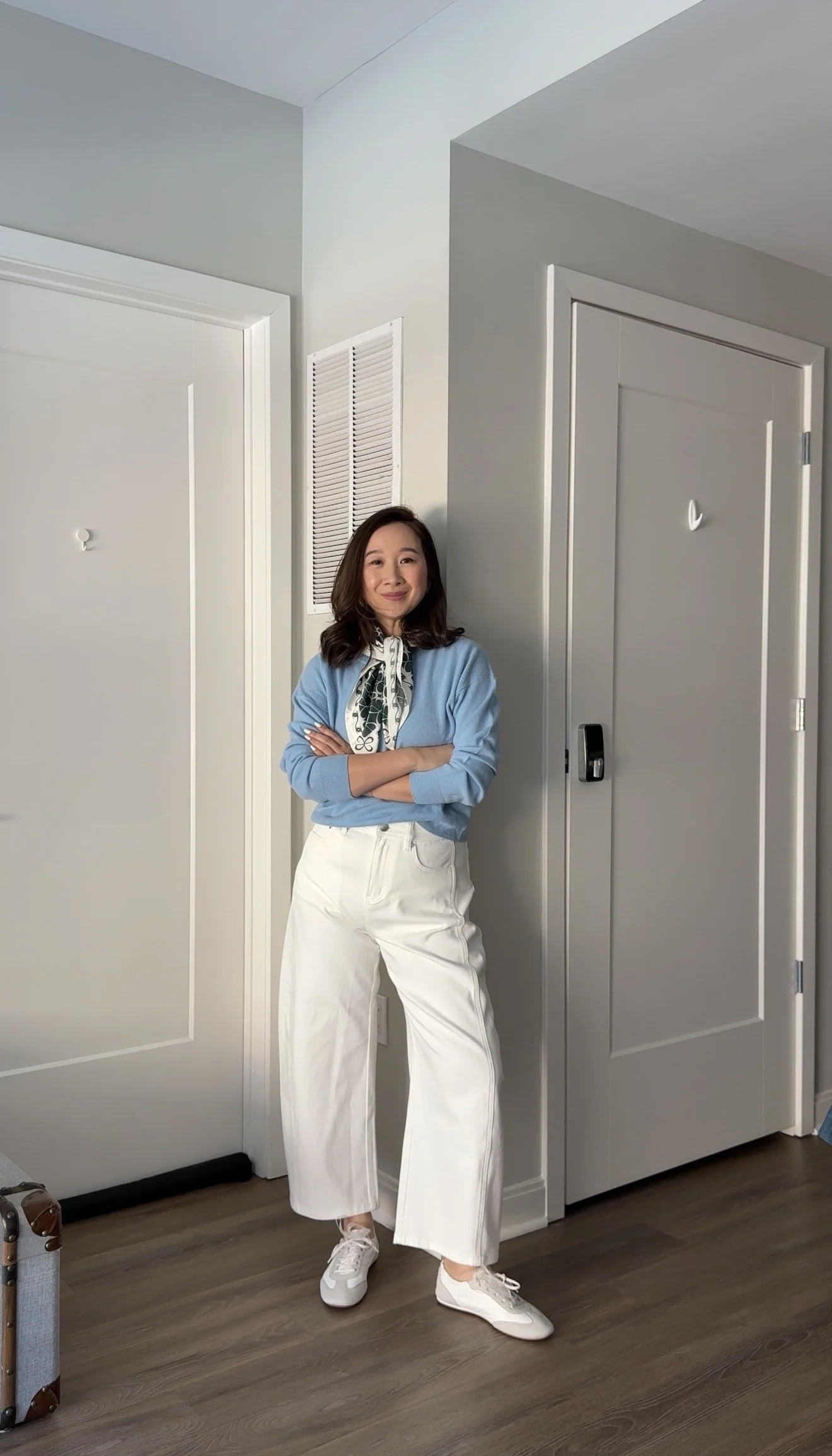 white barrel jeans made for petites styled with baby blue sweater and silk scarf