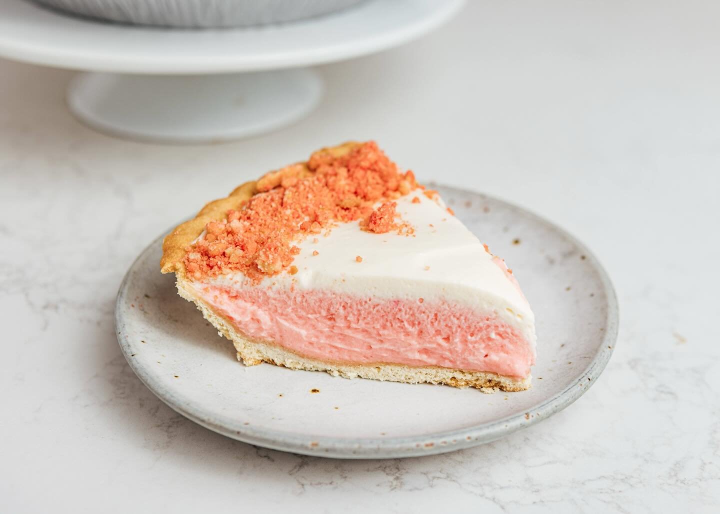 Only a few more weeks for Strawberry Shortcake Pie before our next summer seasonal pie comes into the shops!
Swing by to grab a slice! Inspired by the childhood favorite frozen dessert bar! Housemade shortcake crumble folded into a fluffy pink filli