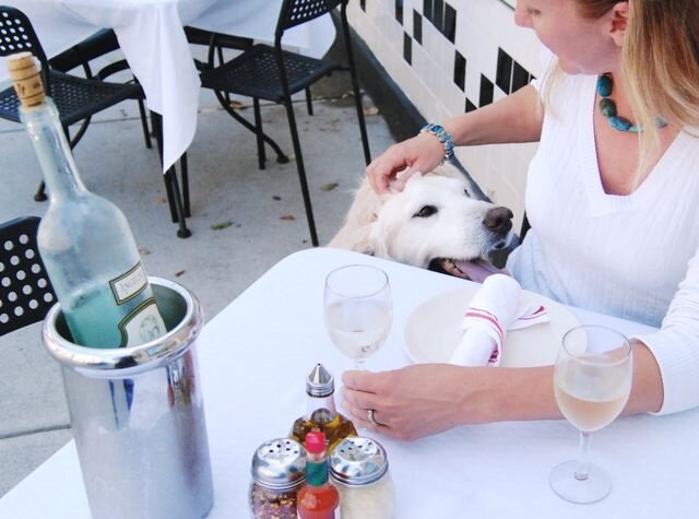 Kate with her pup Murray at the Sidewalk Café.