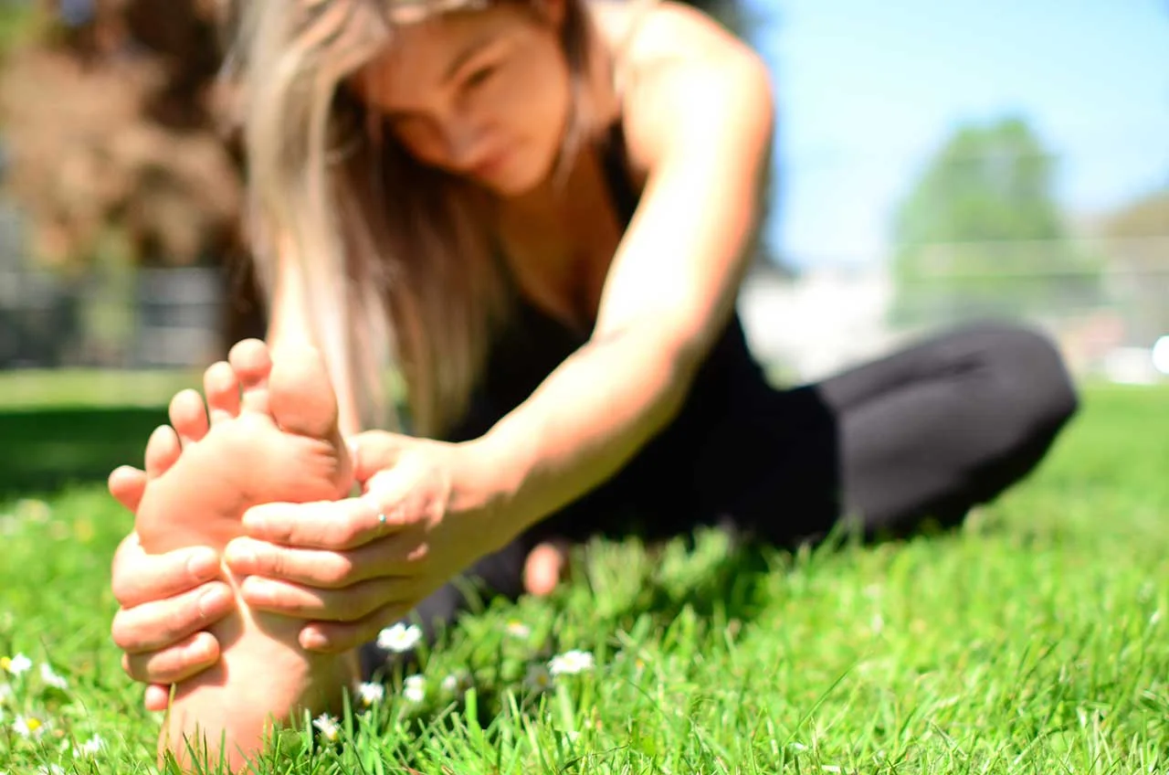 Coach Sara stretching - photo credit: Tianna B.