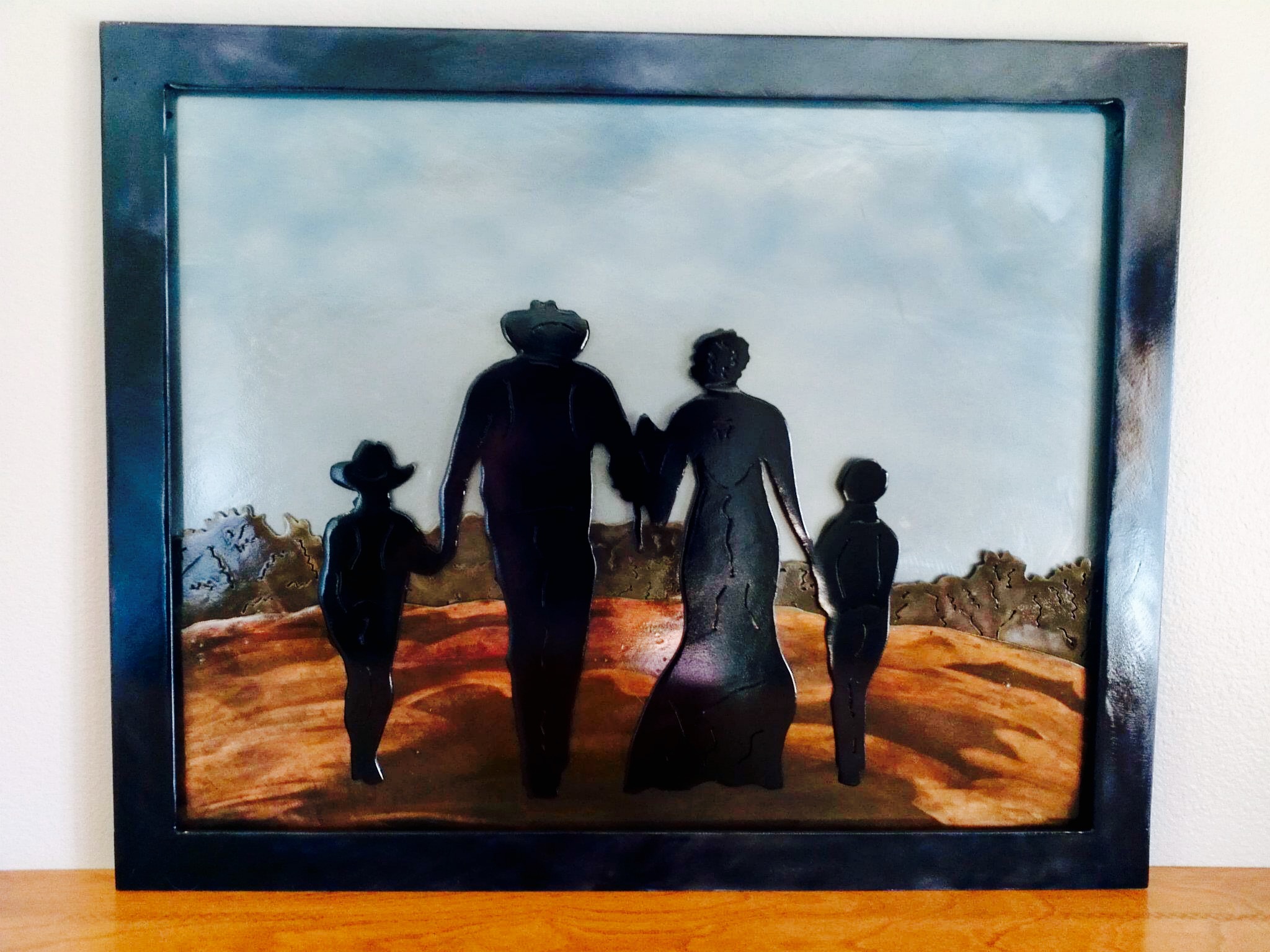 Layered sheet metal silhouette pictures. Various patinas used for affect.
