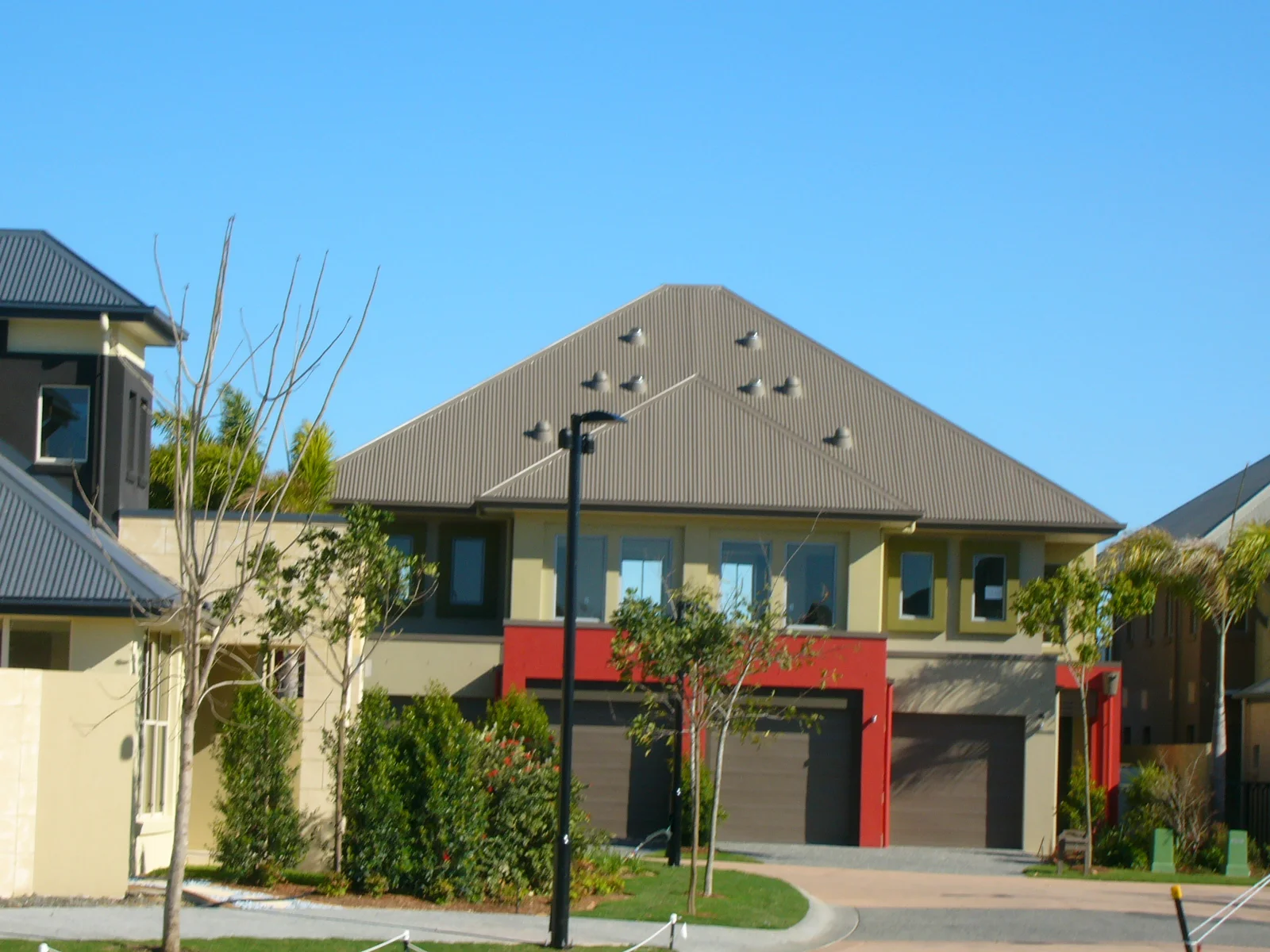 Jennifer Fair Interior and Exterior Designer Emerald Lakes Gold Coast Home Exterior Burnt Orange Colour Accent