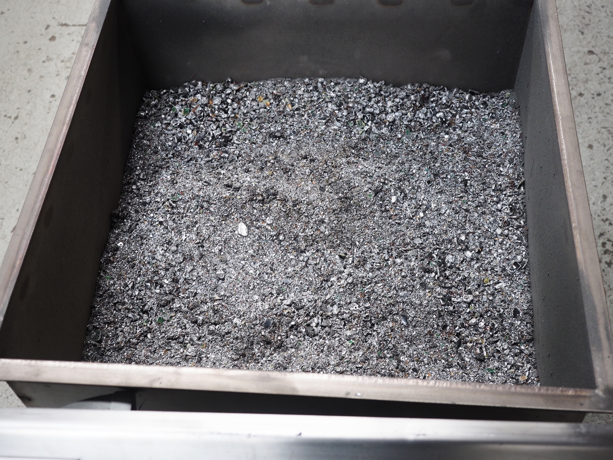 The milled e-waste that comes out of our machine