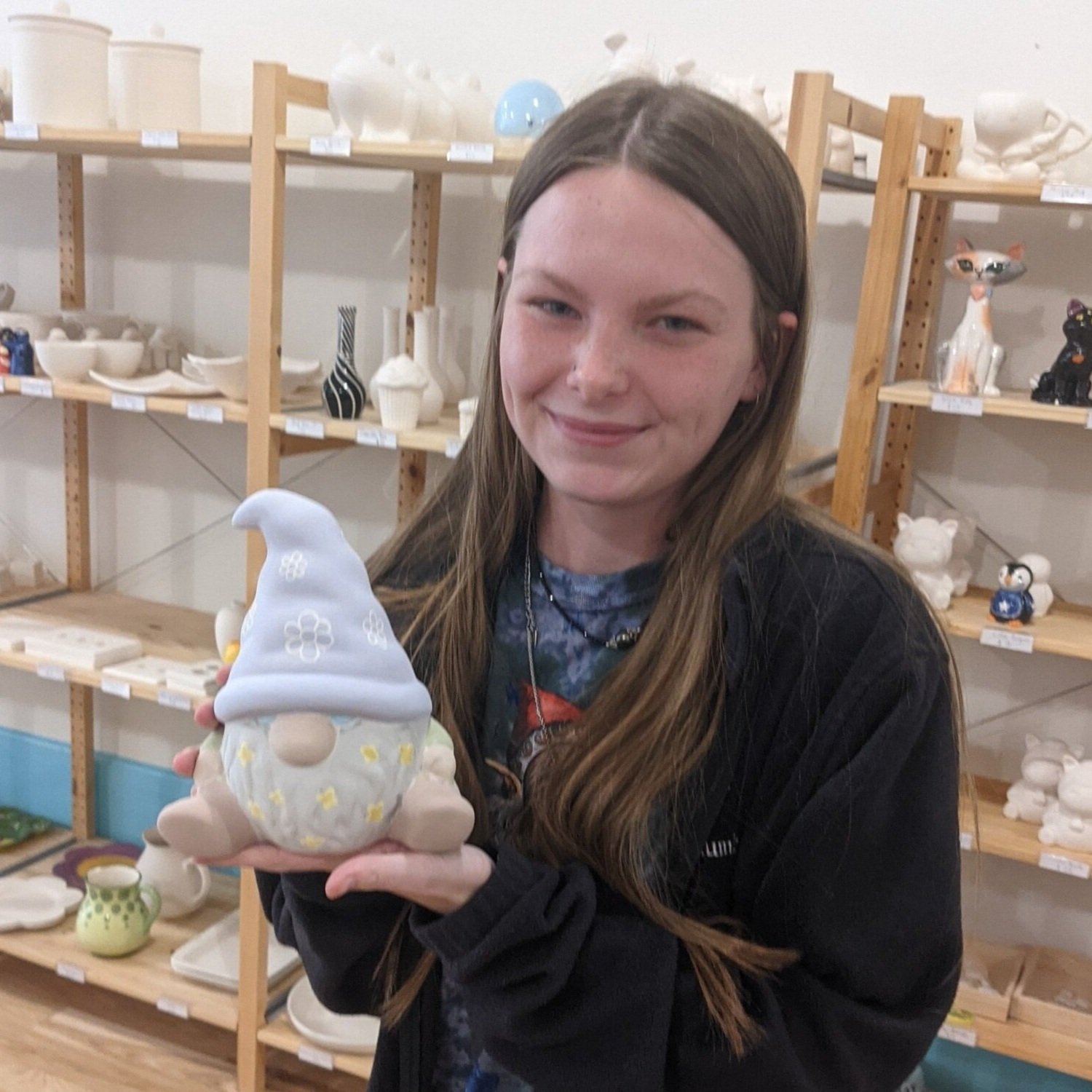 Teen displays her completed Gnome. 