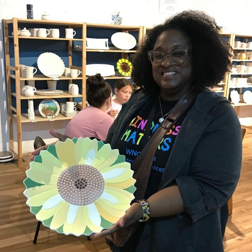 Woman displays completed platter which . her love of her Mother. 