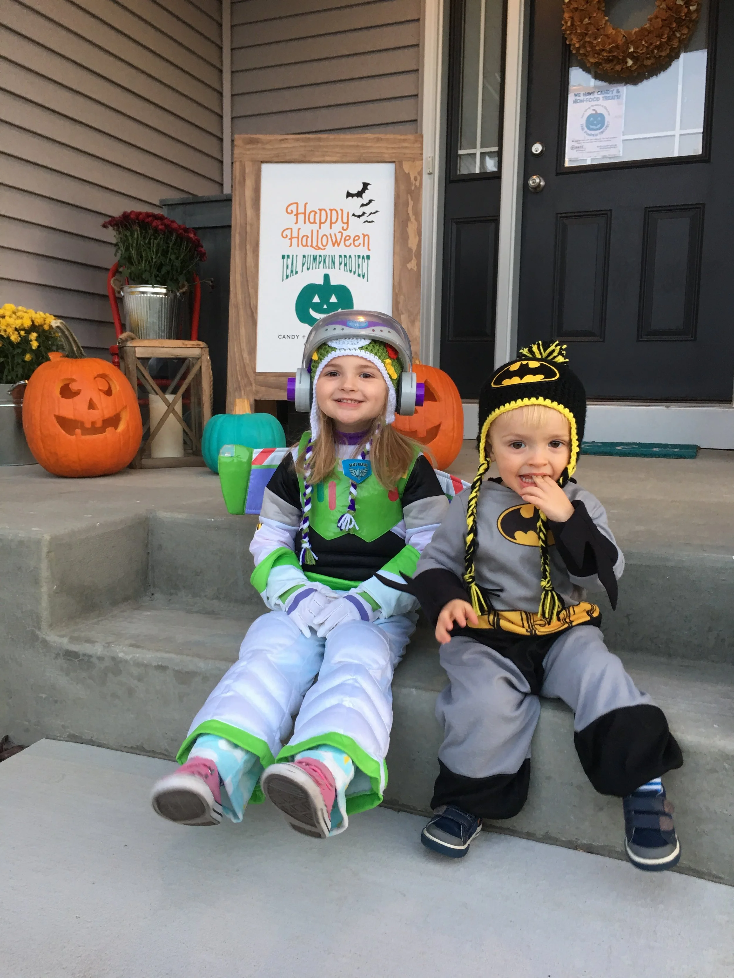 Buzz Lightyear and Batman all ready for some Teal Pumpkin Trick-or-Treating