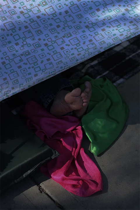 Asylee. Outside Benito Juarez Stadium Complex, Zona Norte, Tijuana. November, 2018. Migrants sleep outside the shelter waiting for entry into Benito Juarez stadium complex.