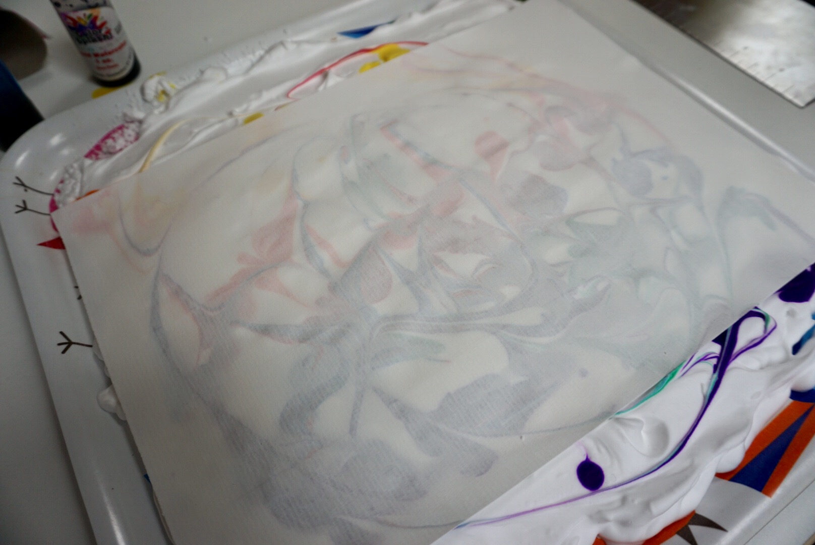 Drop a piece of thick paper or card on top of the foam and gently tap the paper to ensure it has made contact with the foam.