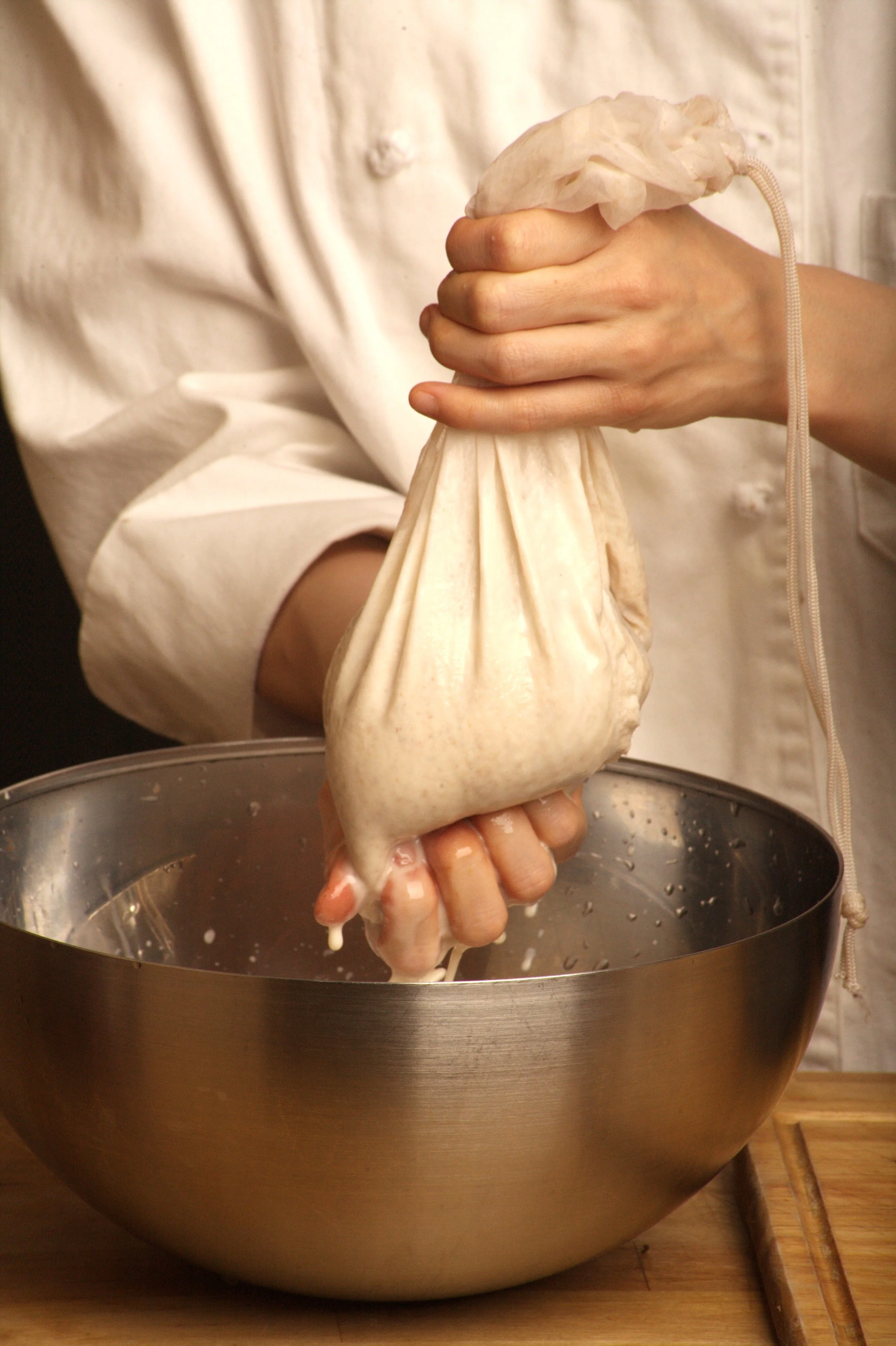 Using a Nut Milk Bag (or Cheese Cloth) to Strain the Milk