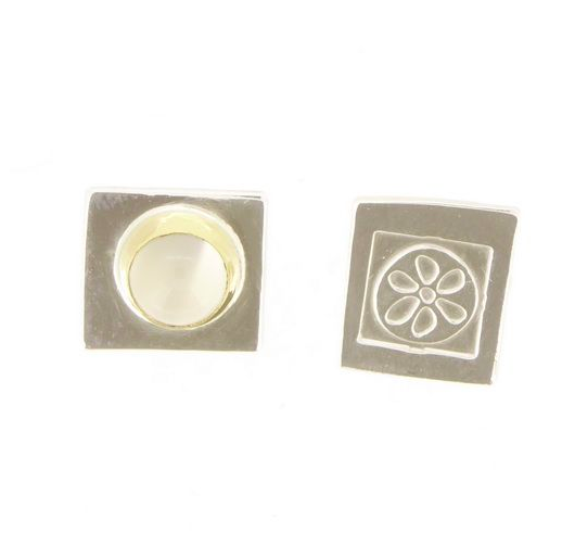 Small asymmetrical ear studs.png