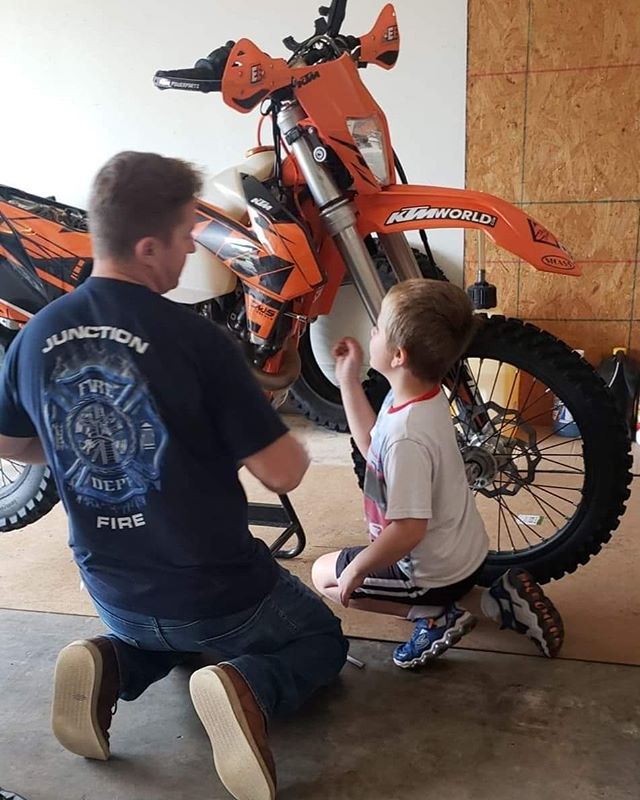 Showing my new garage buddy how to fix up a dirt bike.