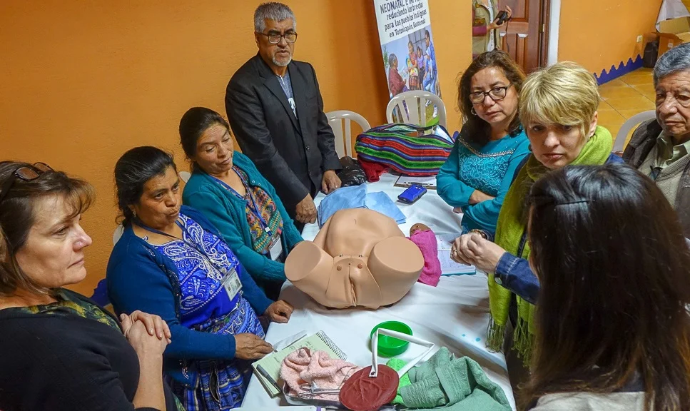 A knowledge exchange workshop involving Canadian participants, traditional Indigenous Maya midwives, Guatemalan doctors, and Guatemalan Ministry of Health representatives