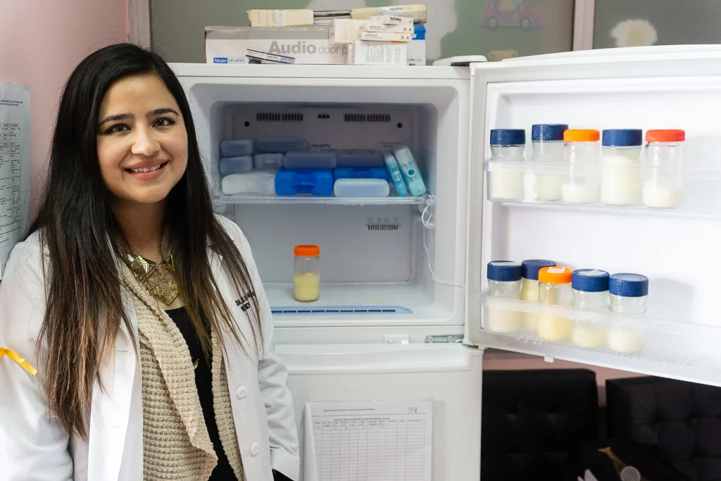 Silvia Maria España Garcia, Head of Nutrition at the Totonicapán Hospital, demonstrates the donated breast milk, kept frozen for use by hospitalized newborns.