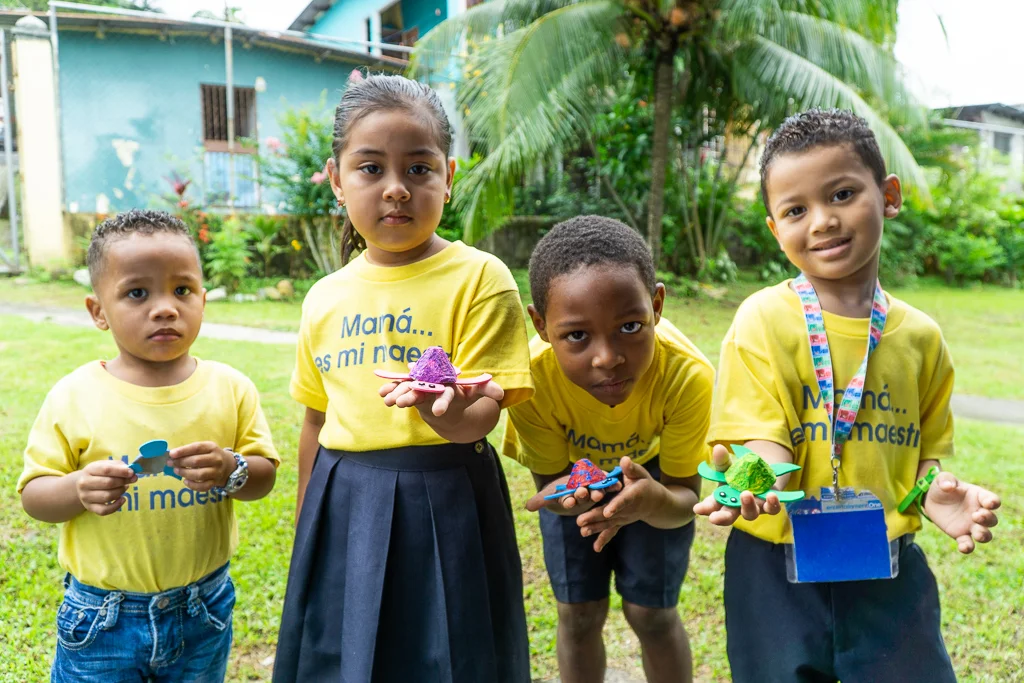 Youth at the Madres Maestras youth community centre showing off their latest arts and crafts in San Miguelito, Panama.