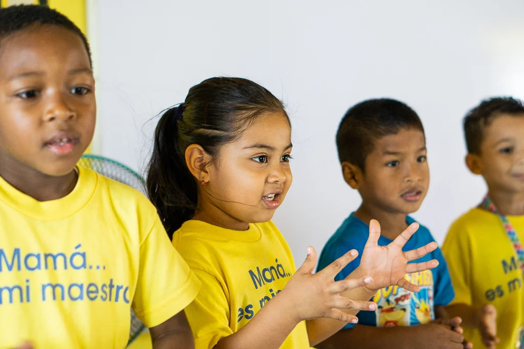 8-year old Arielly clapping along to a morning song and dance at the Madres Maestras community centre in San Miguelito, Panama.