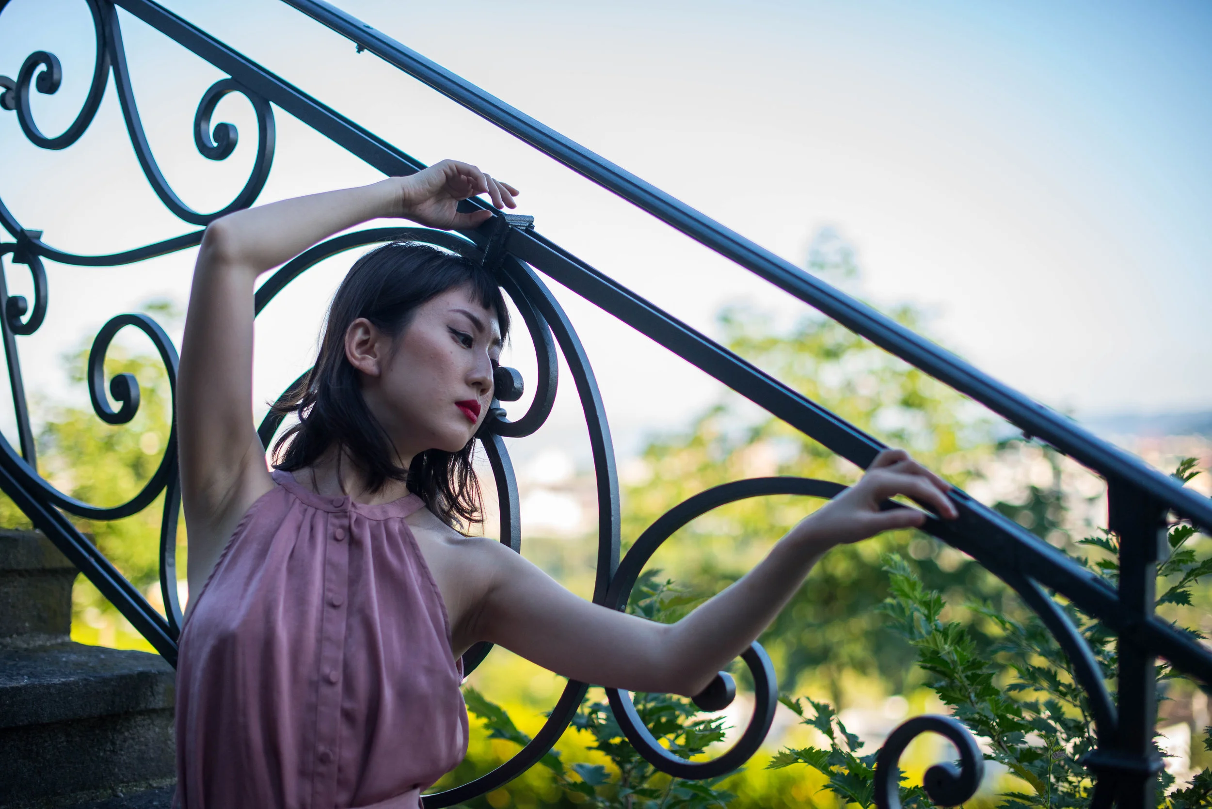model next to stair handrail