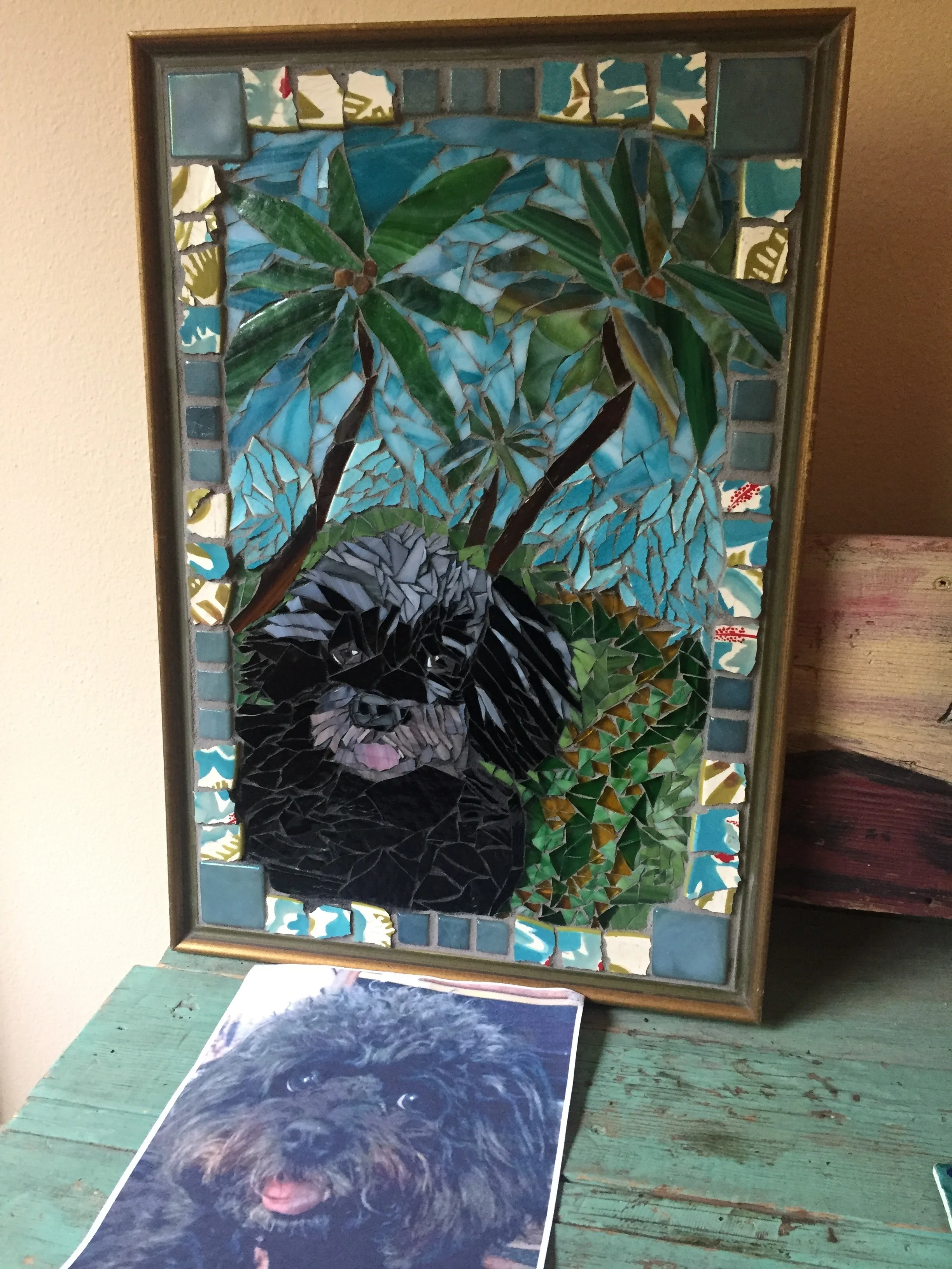  A surprise birthday gift for a very special client. Mollie's owner loves Palm trees. I enjoyed breaking dishes for the outside frame to give it dimension. This frame was found in a Art for Scrap studio. Green sea glass is part of the grass.&nbsp; 