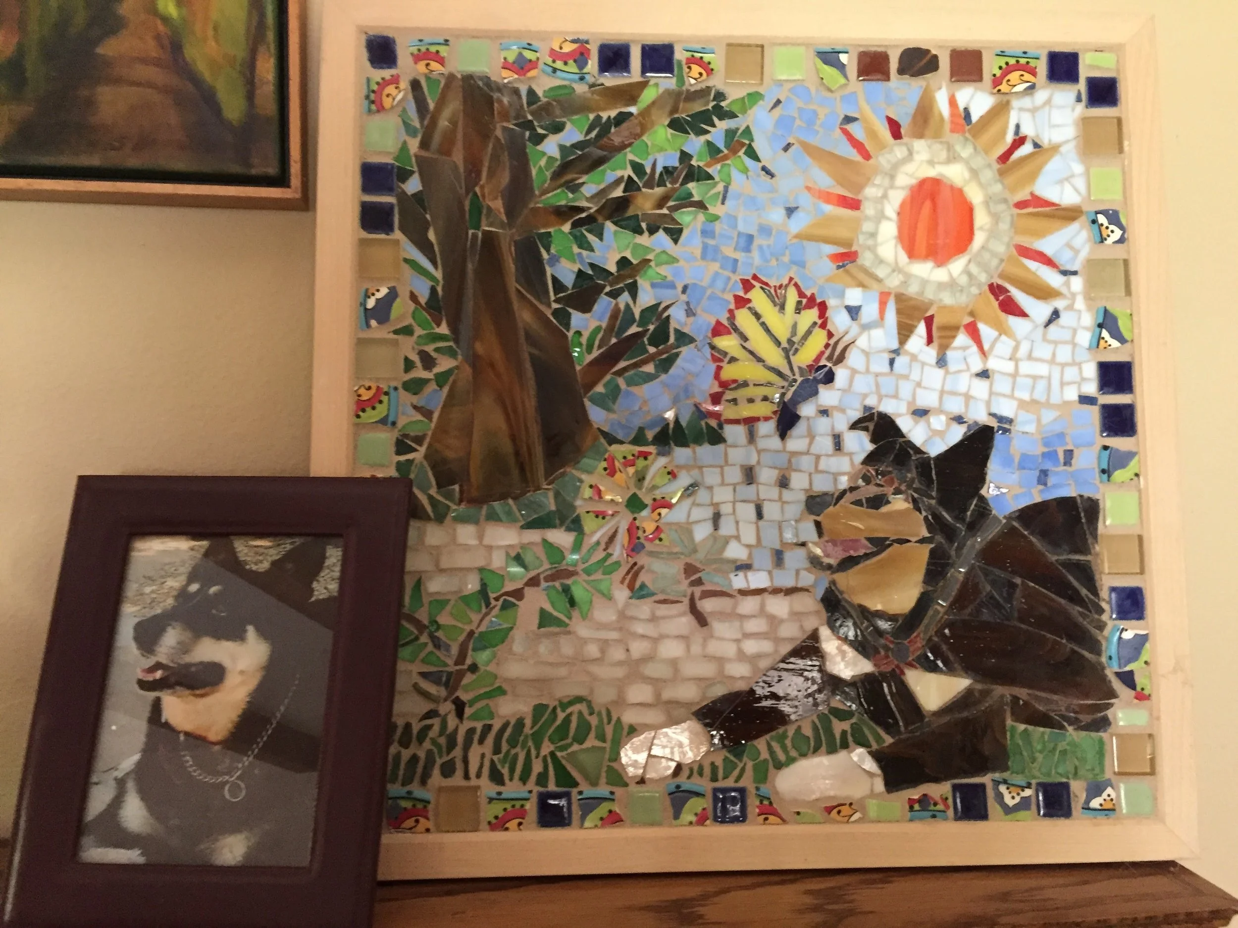  This is my first mosaic of our guard dog. I used lots of sea glass from our recent trip to Scotland.&nbsp; 