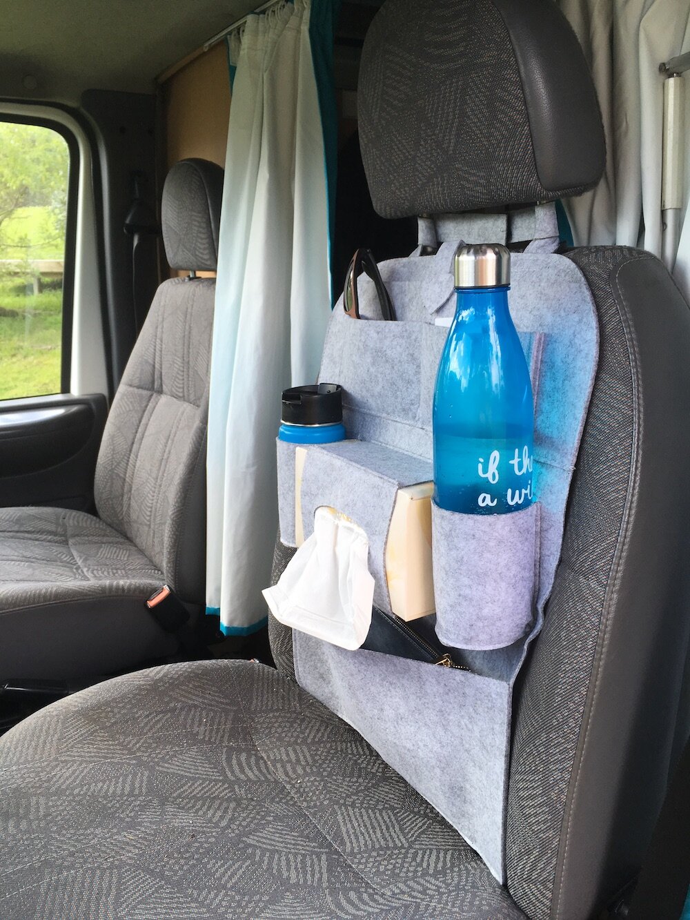  I use a seat organiser to keep my passenger seat tidy and things handy while driving.  