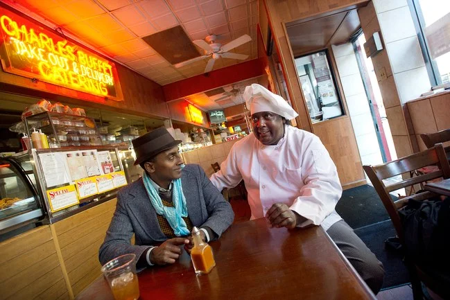 Marcus Samuelsson (left) with Charles Gabriel, the owner of Charles’ Country Pan Fried Chicken, in Harlem. Photograph by Joshua Bright/The New York Times/Redux