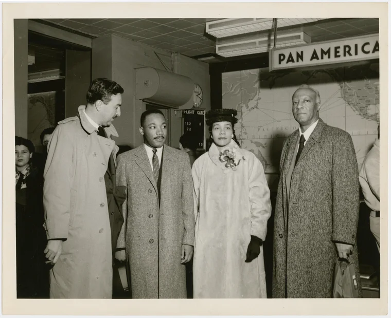 Dr. Martin Luther King, Jr. and his wife Coretta being greeted by Rev. Adam Clayton Powell, Jr. (left) and labor leader A. Philip Randolph (right) at the Pan American World Airways terminal, in New York City: Image: Schomburg Center for Research in Black Culture, Photographs and Prints Division, The New York Public Library. (1950 – 1959).