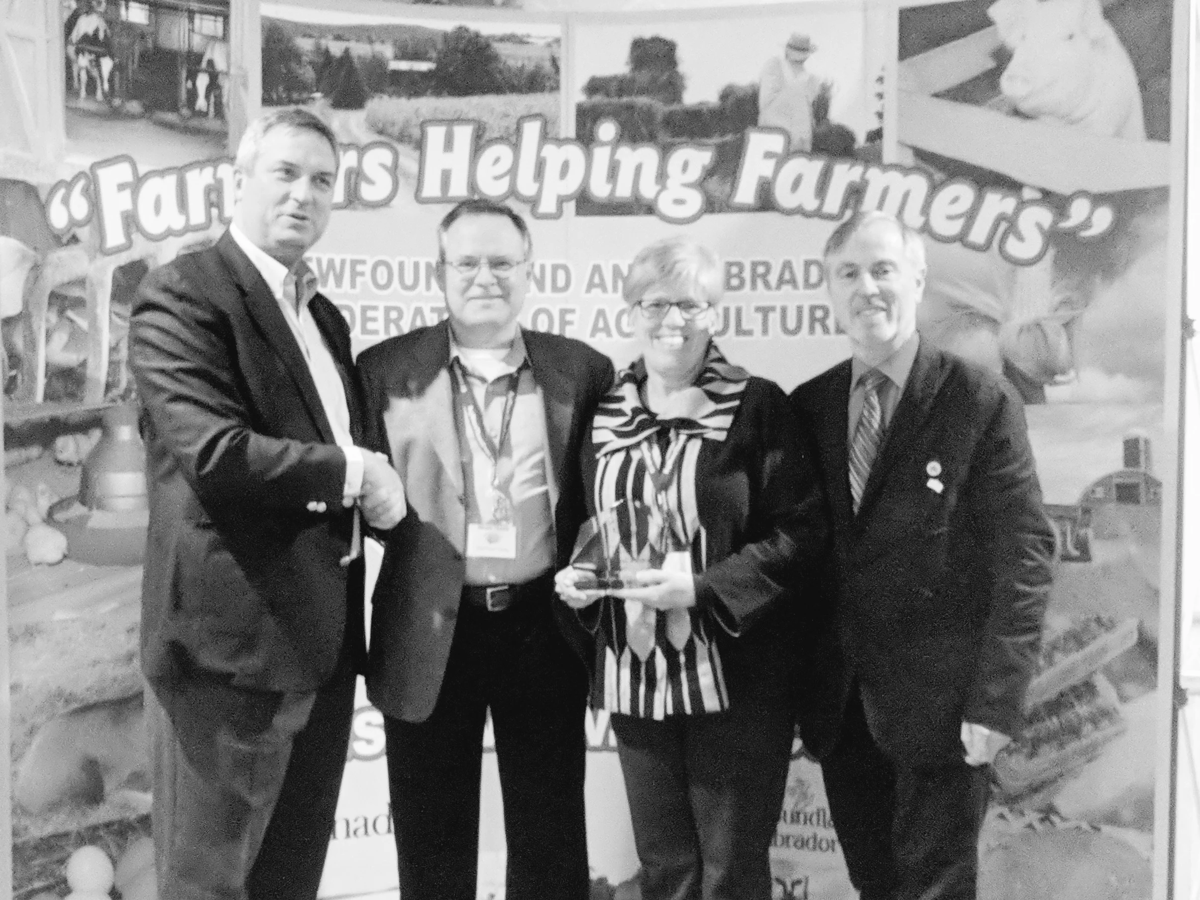 The Natural Gardener, a mixed vegetable operation in Ferryland, N.L., which also produces kelp-based soil conditioners, received the NLFA’s environmental award. From left, Fisheries and Land Resources Minister Gerry Byrne, Brian and Jane Yager of the Natural Gardener, and NLFA president Merv Wiseman. (Submitted photo)