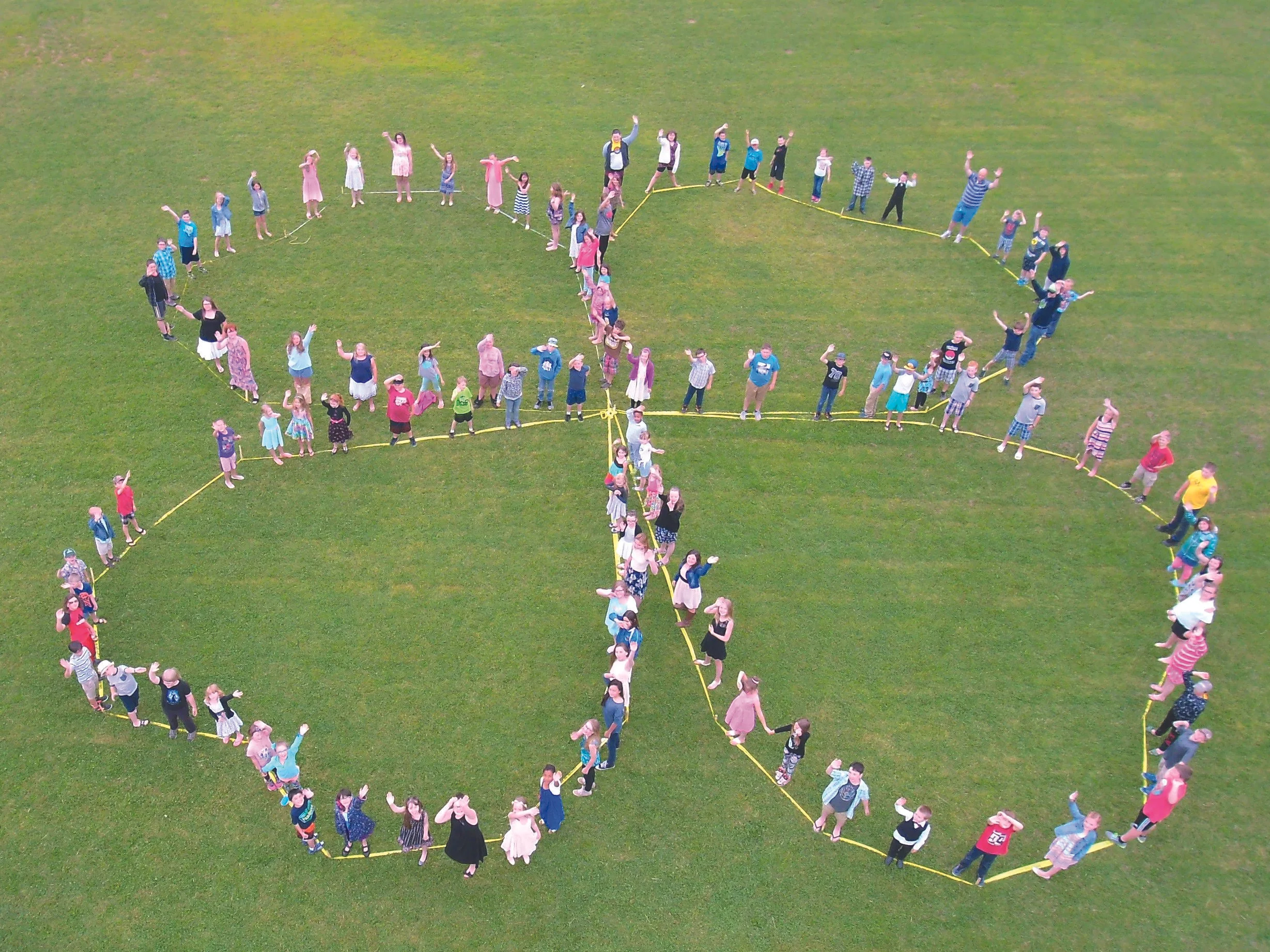 Students at a local elementary school helped Country View 4-H Club members form a giant human clover. (Submitted photo)