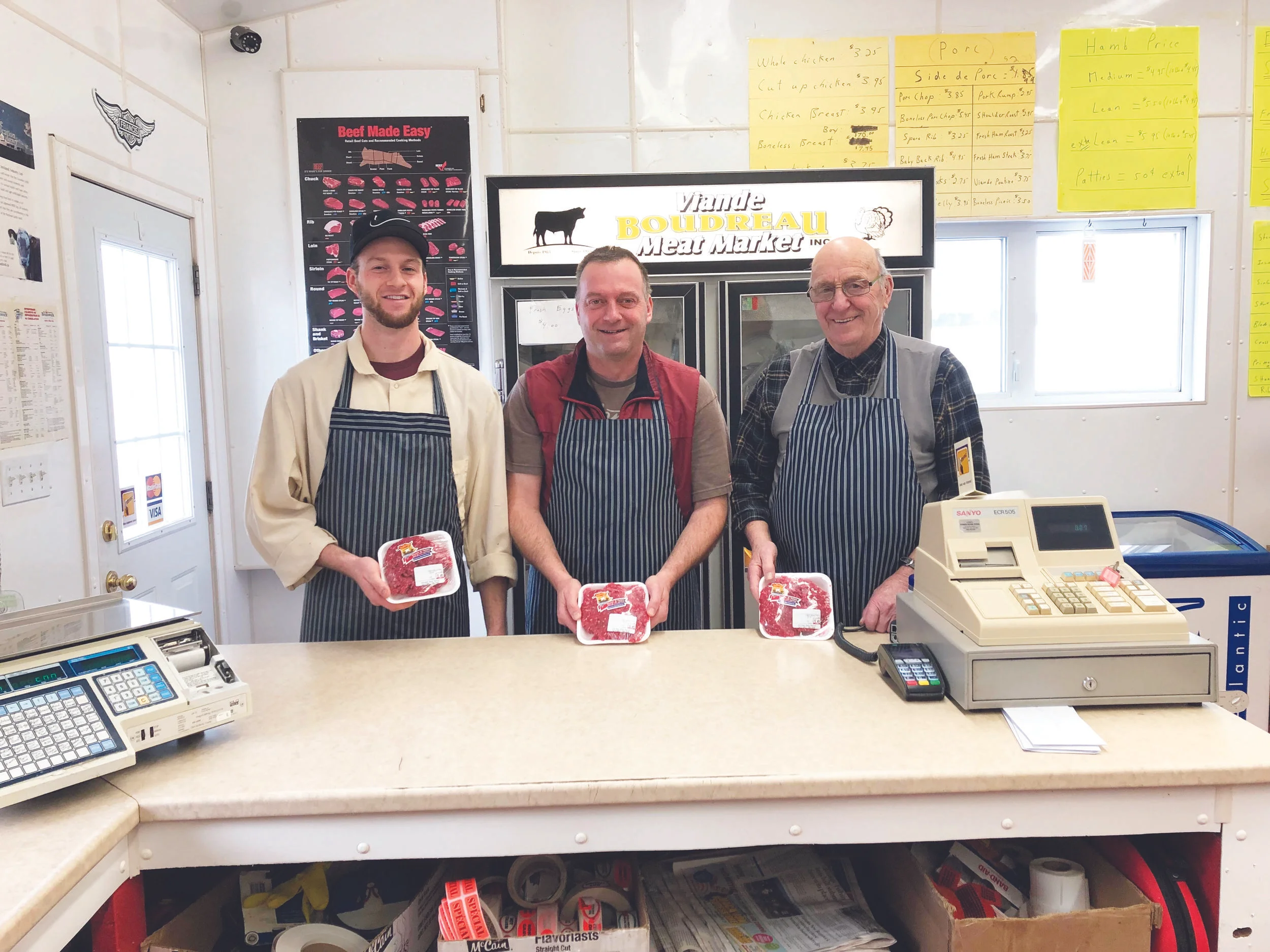 Three generations inside the Boudreau family’s meat market, from left, Jocelyn, Guy, and Donald Boudreau. (Submitted photo)