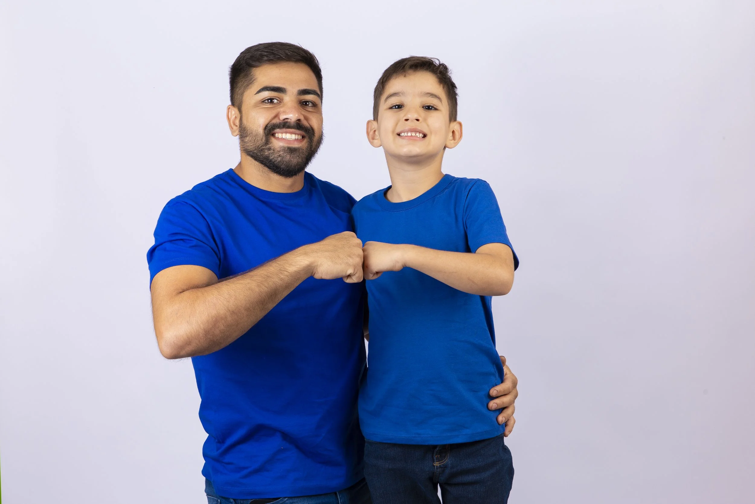 handsome-bearded-man-standing-his-son-smiling-camera.jpg