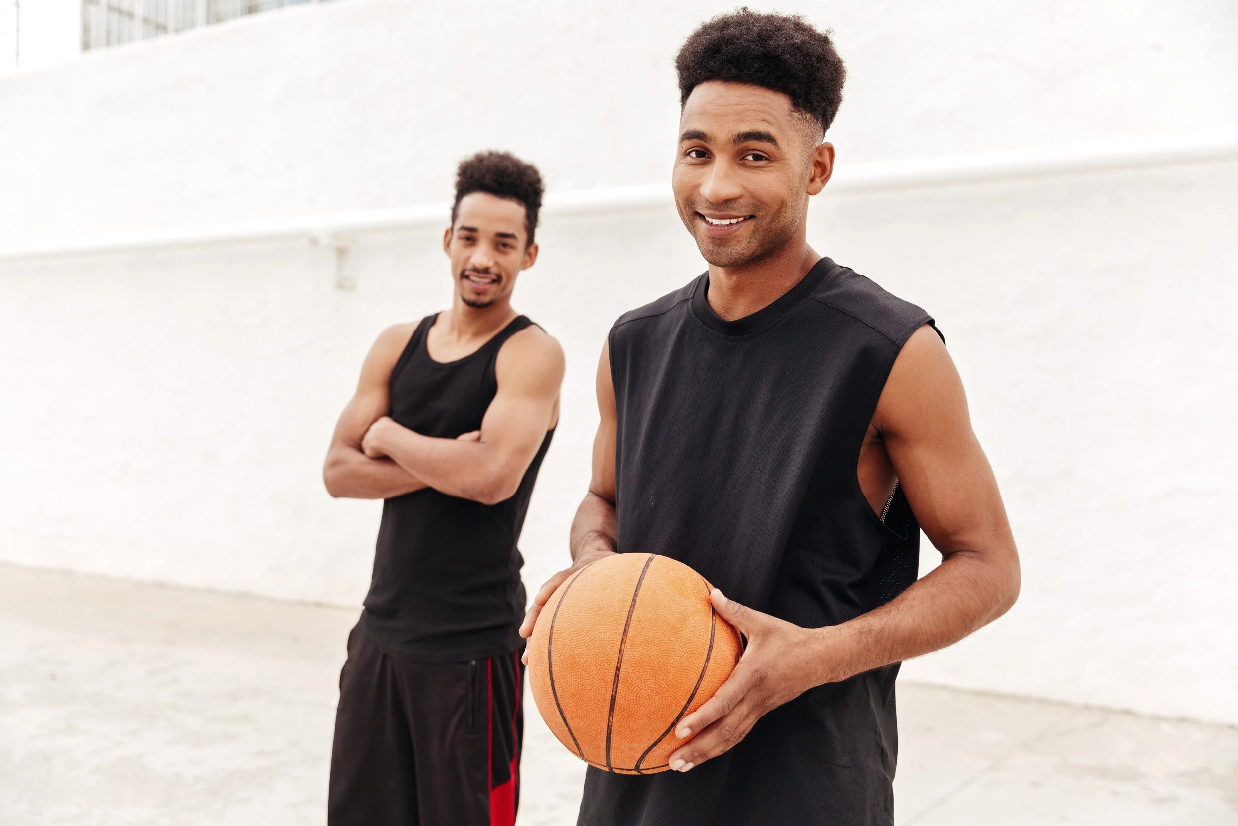 happy-young-african-sports-men-with-basketball.jpg
