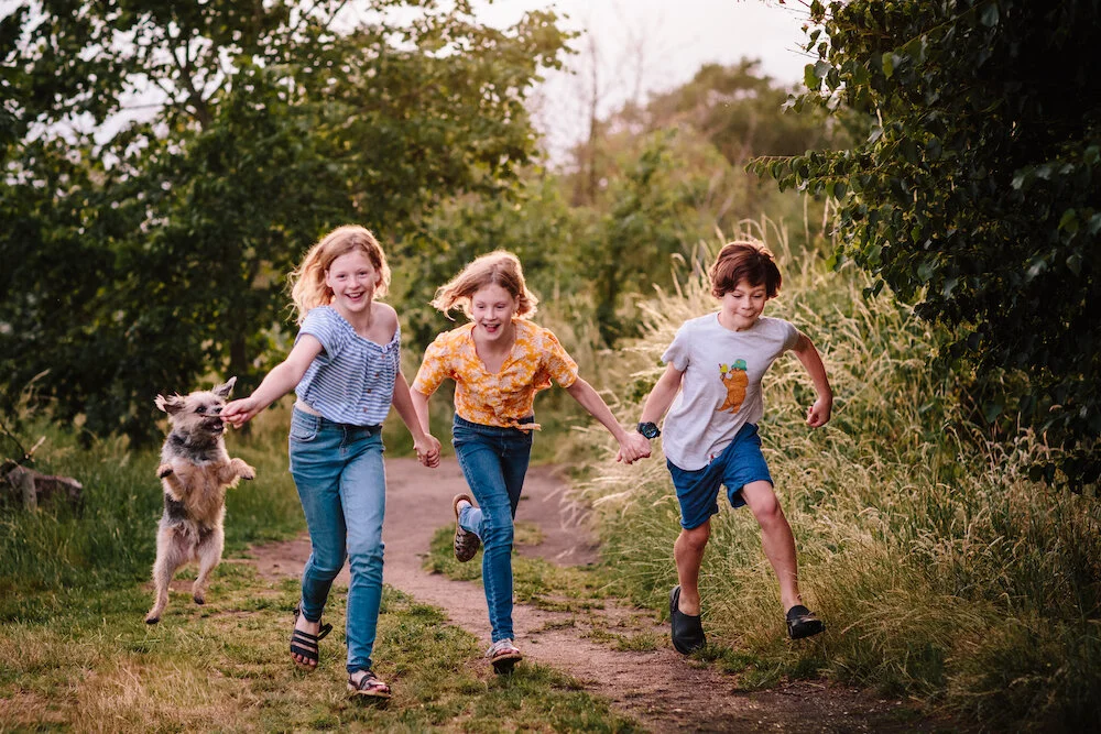 Couples Engagement Photoshoot with a professional London Photographer with three kids and their dog