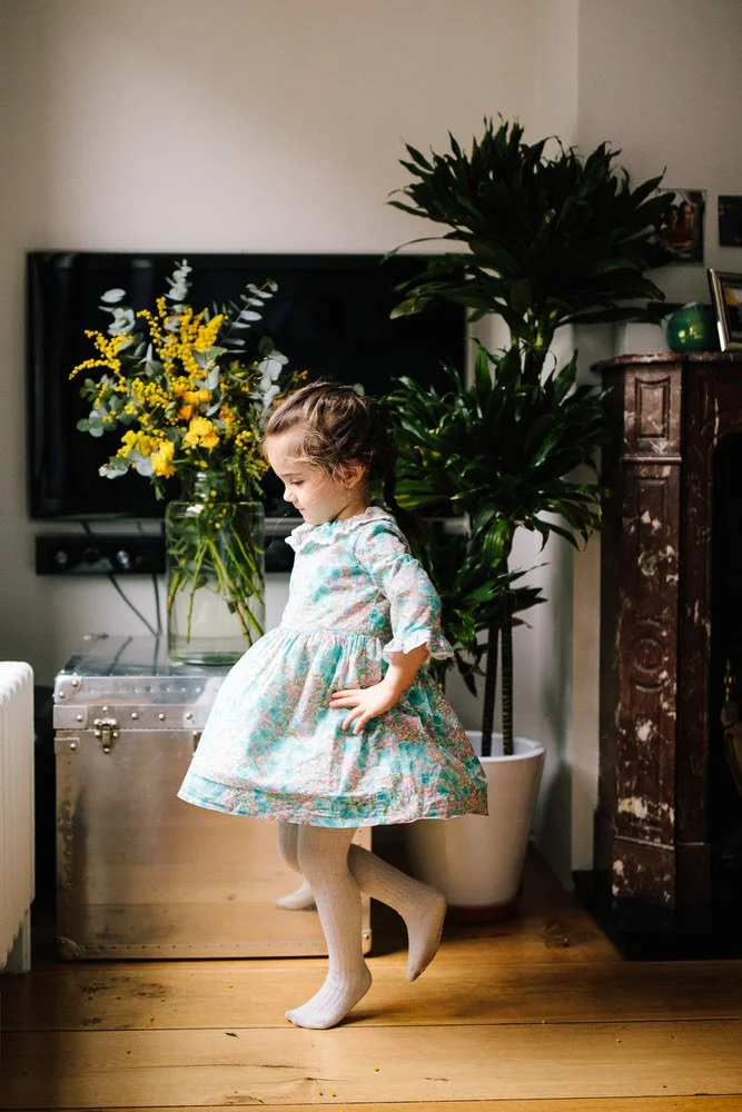 Girl spins in home for London Familt Photographer