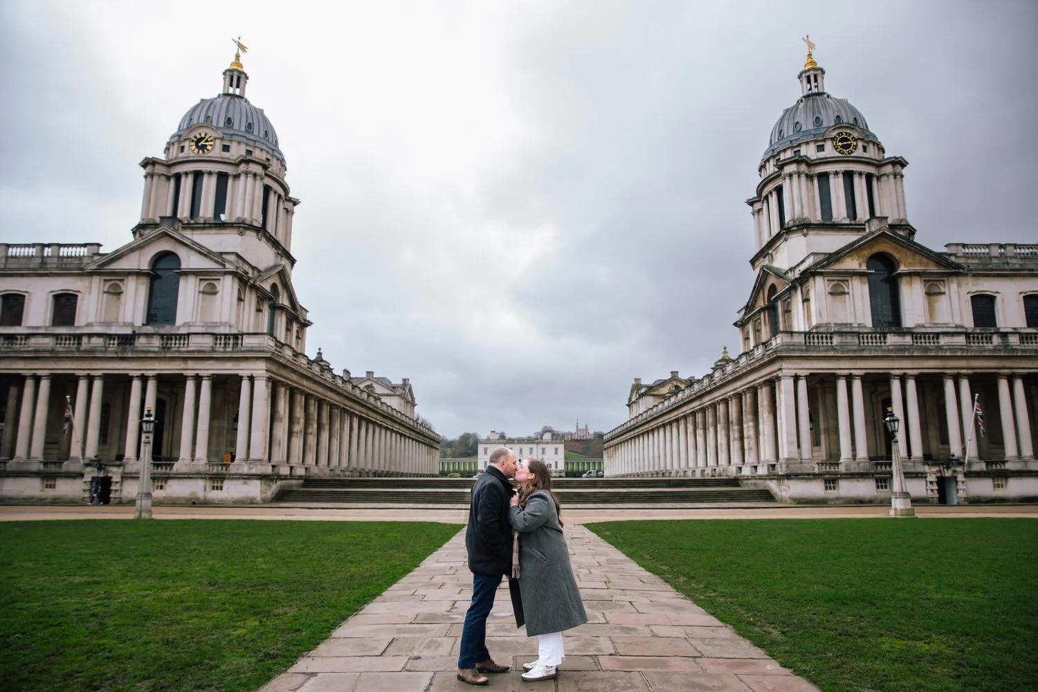Couple kiss after getting engaged during Old London Royal Naval College Photoshoot